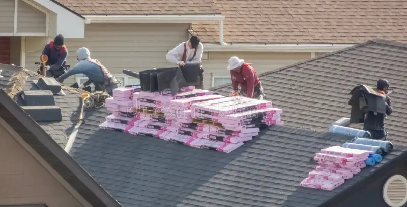 calgary-alberta-canada-may-roofers-installing-shingles-residential-roof-stacks-roofing-materials-visible-380049932