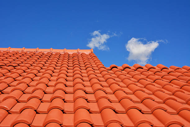 red roof texture tile and blue sky with cloud in background
